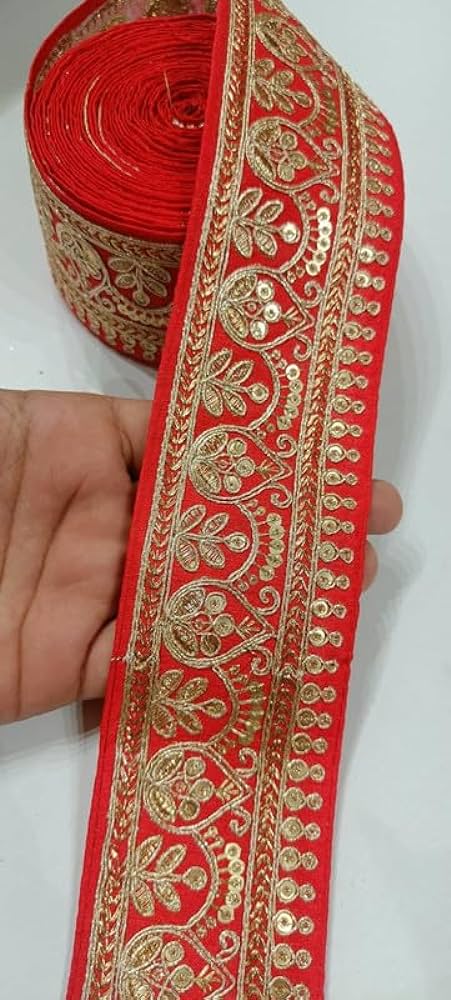 Border of the woman's garment.